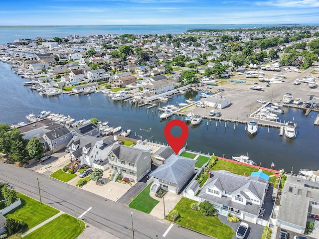 248 E Shore Rd, Lindenhurst, NY 11757 - aerial perspective of suburban area with a marina and a large body of water