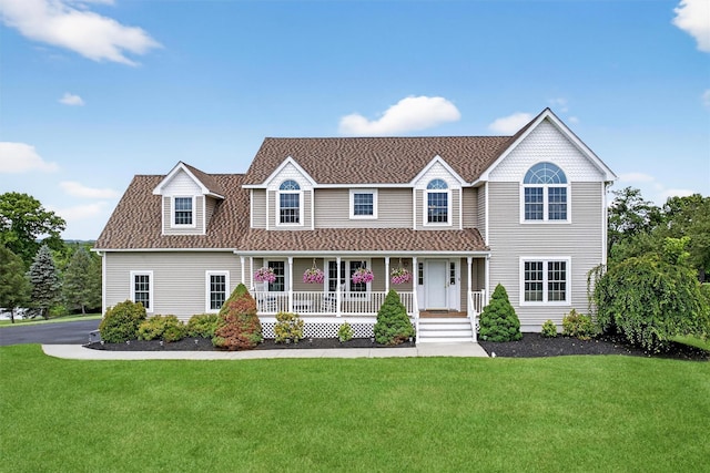 106 Maple Ave, Goshen, NY 10924 - view of front facade featuring a porch, a front lawn, and a shingled roof