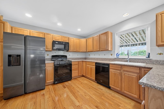 106 Maple Ave, Goshen, NY 10924 - kitchen with black appliances, light wood-style flooring, tasteful backsplash, and recessed lighting