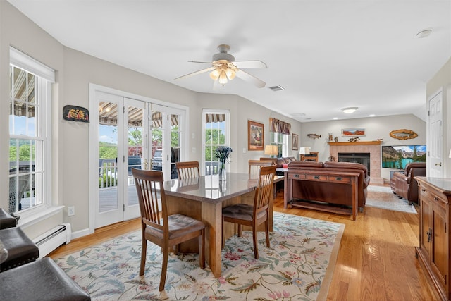 106 Maple Ave, Goshen, NY 10924 - dining space with a baseboard radiator, a ceiling fan, healthy amount of natural light, and light wood-type flooring