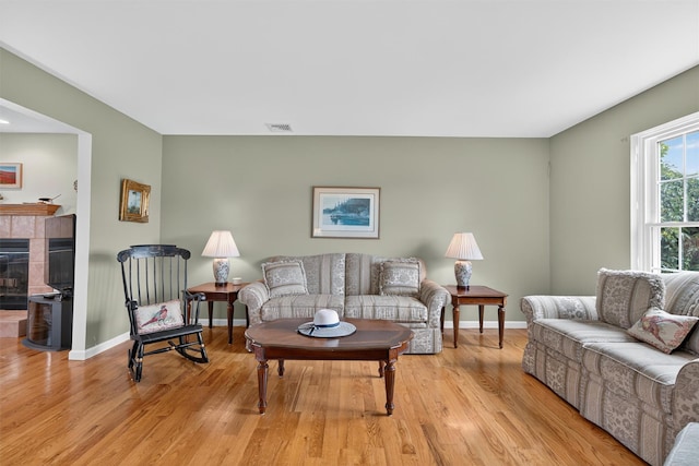 106 Maple Ave, Goshen, NY 10924 - living area featuring light wood-style floors and a fireplace