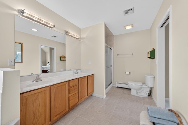106 Maple Ave, Goshen, NY 10924 - ensuite bathroom with a baseboard heating unit, double vanity, tile patterned floors, and a stall shower