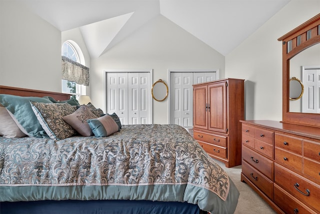 106 Maple Ave, Goshen, NY 10924 - bedroom with light colored carpet, multiple closets, and lofted ceiling