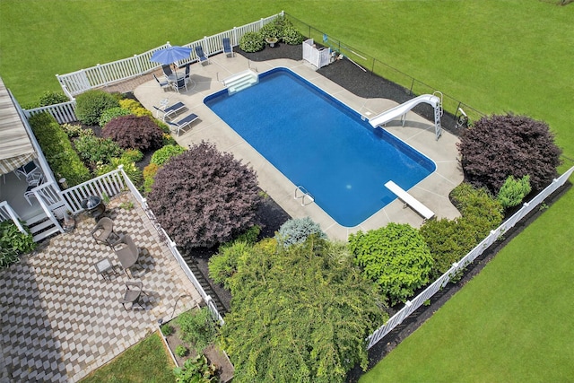 106 Maple Ave, Goshen, NY 10924 - view of swimming pool featuring a diving board, a fenced backyard, a water slide, and a patio area