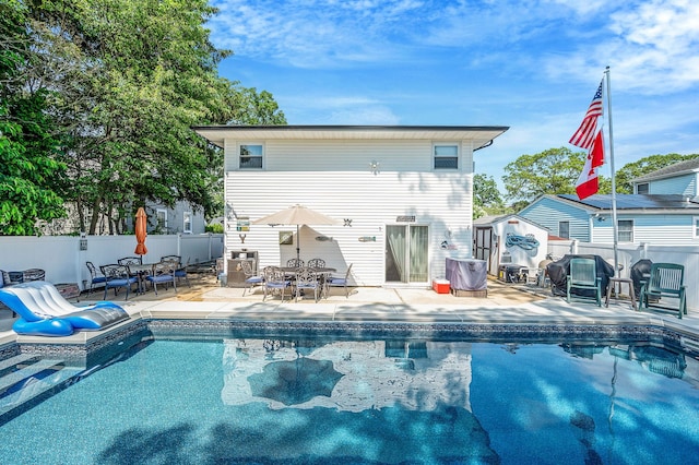 511 N Delaware Ave, Lindenhurst, NY 11757 - view of pool featuring a patio, a fenced backyard, and outdoor dining area