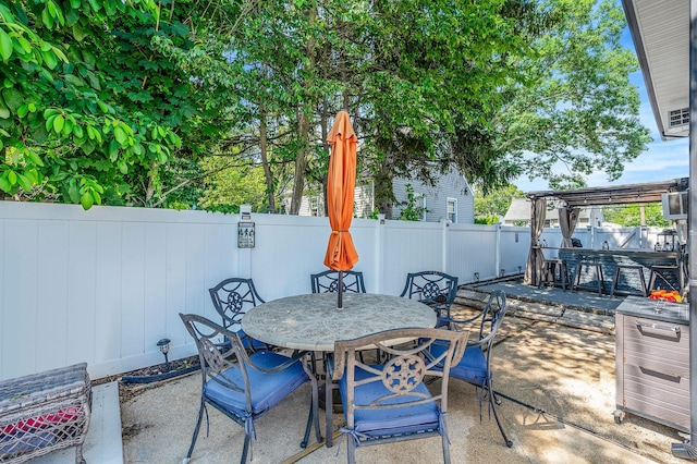 511 N Delaware Ave, Lindenhurst, NY 11757 - fenced backyard with outdoor dining area and a patio area