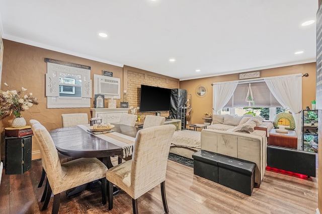 511 N Delaware Ave, Lindenhurst, NY 11757 - dining space with a wall mounted air conditioner, crown molding, wood finished floors, and recessed lighting