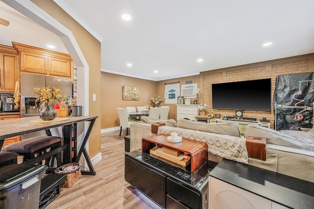 511 N Delaware Ave, Lindenhurst, NY 11757 - living area featuring light wood finished floors, ornamental molding, recessed lighting, and an AC wall unit