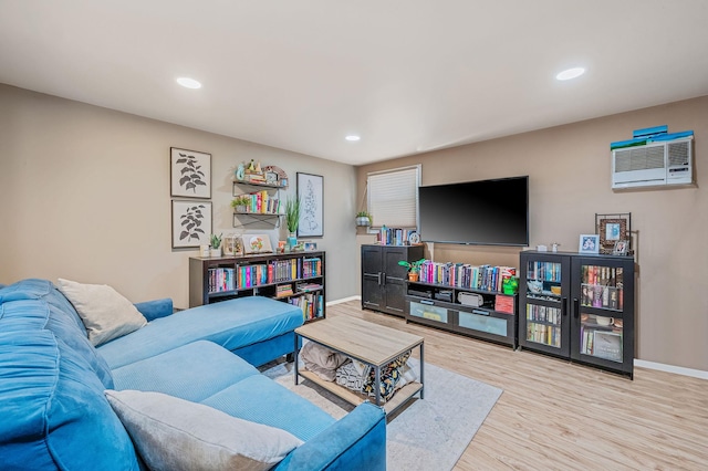 511 N Delaware Ave, Lindenhurst, NY 11757 - living area featuring a wall unit AC, wood finished floors, and recessed lighting