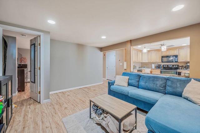 511 N Delaware Ave, Lindenhurst, NY 11757 - living room featuring light wood-style floors and recessed lighting
