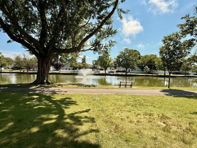 511 N Delaware Ave, Lindenhurst, NY 11757 - surrounding community with a water view and a lawn