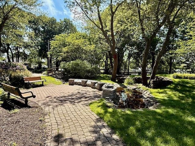 511 N Delaware Ave, Lindenhurst, NY 11757 - view of community featuring a lawn and a patio
