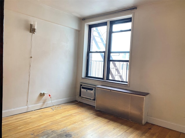 13705 Franklin Ave Unit 6L, Flushing, NY 11355 - empty room with light wood-type flooring and a wall unit AC
