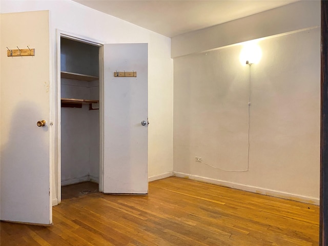 13705 Franklin Ave Unit 6L, Flushing, NY 11355 - unfurnished bedroom featuring hardwood / wood-style flooring and a closet