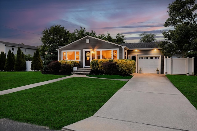 414 Pecan St, Lindenhurst, NY 11757 - view of front facade featuring driveway, a garage, and a shingled roof