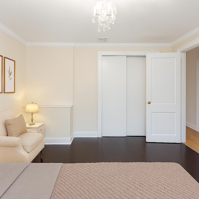 414 Pecan St, Lindenhurst, NY 11757 - bedroom with wood finished floors, ornamental molding, a closet, and a chandelier