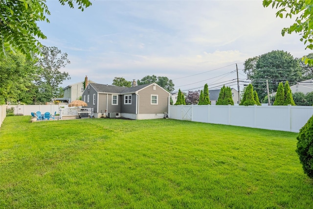 414 Pecan St, Lindenhurst, NY 11757 - rear view of property with a fenced backyard and a chimney
