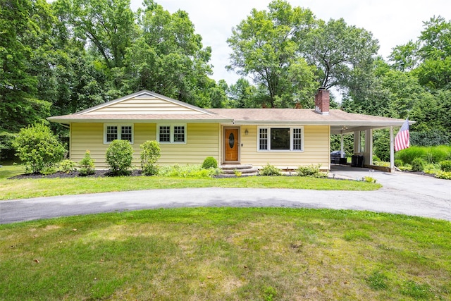 18 Alexander Blvd, Poughkeepsie, NY 12603 - ranch-style house with a carport, asphalt driveway, a chimney, a front yard, and roof with shingles
