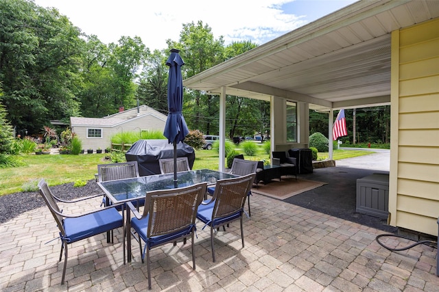 18 Alexander Blvd, Poughkeepsie, NY 12603 - view of patio featuring area for grilling, outdoor dining space, an outdoor structure, and view of wooded area