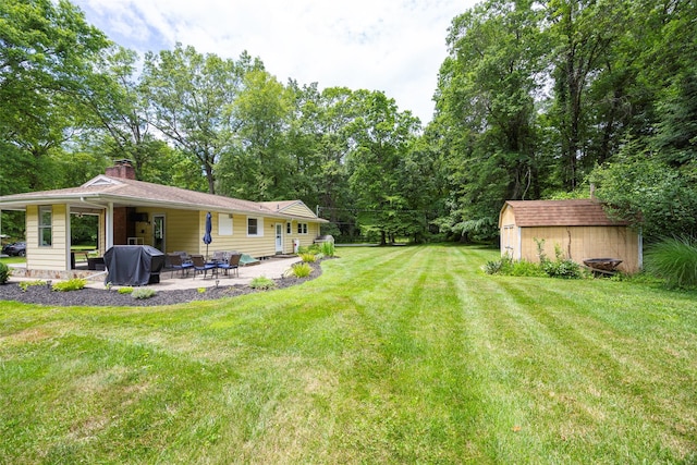 18 Alexander Blvd, Poughkeepsie, NY 12603 - view of grassy yard with a patio and a storage unit