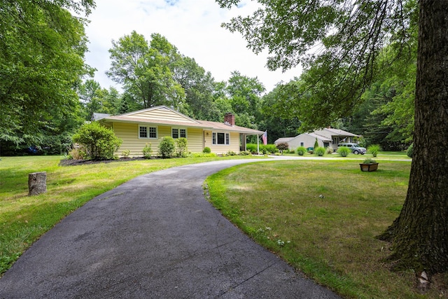 18 Alexander Blvd, Poughkeepsie, NY 12603 - single story home with a chimney, asphalt driveway, and a front lawn