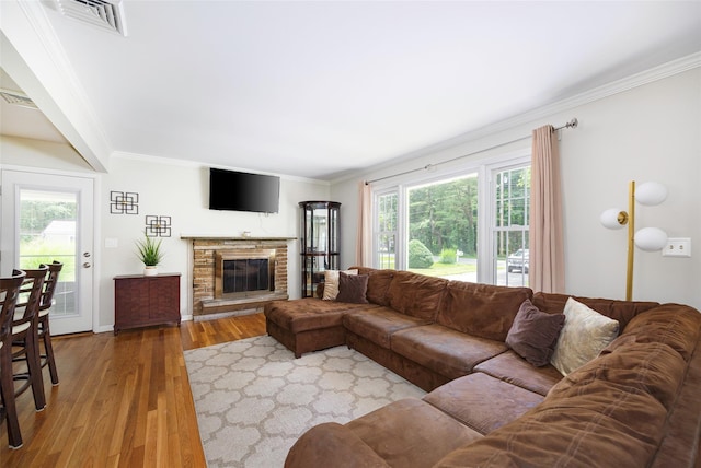 18 Alexander Blvd, Poughkeepsie, NY 12603 - living area with ornamental molding, healthy amount of natural light, wood finished floors, and a brick fireplace