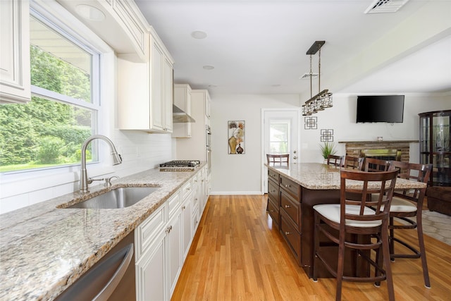18 Alexander Blvd, Poughkeepsie, NY 12603 - kitchen featuring appliances with stainless steel finishes, white cabinetry, healthy amount of natural light, and light wood-style floors