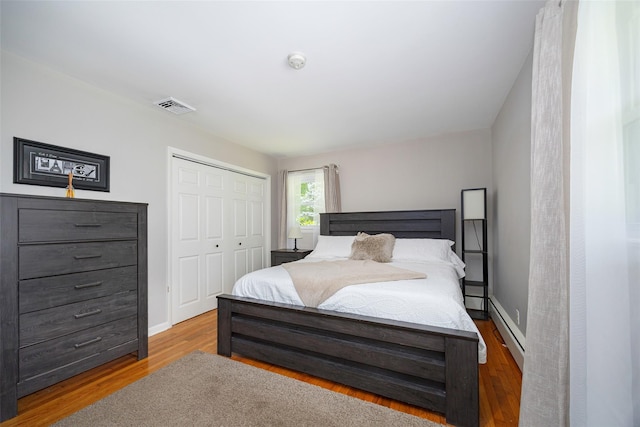 18 Alexander Blvd, Poughkeepsie, NY 12603 - bedroom featuring a closet, wood finished floors, and baseboard heating