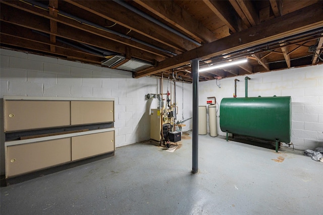 18 Alexander Blvd, Poughkeepsie, NY 12603 - unfinished below grade area with oil tank, concrete block wall, a heating unit, and a water softener