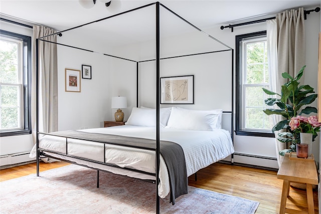 27 Maple Rd, Lake Peekskill, NY 10537 - bedroom featuring wood finished floors and a baseboard heating unit