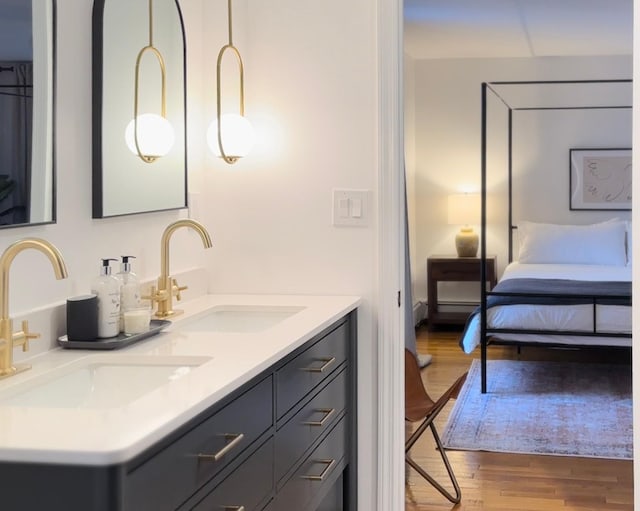 27 Maple Rd, Lake Peekskill, NY 10537 - ensuite bathroom with wood finished floors and double vanity