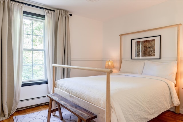 27 Maple Rd, Lake Peekskill, NY 10537 - bedroom featuring a baseboard heating unit and light wood-type flooring