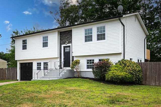 4 S Cardinal Ct, Islip, NY 11706 - split foyer home featuring a garage and driveway