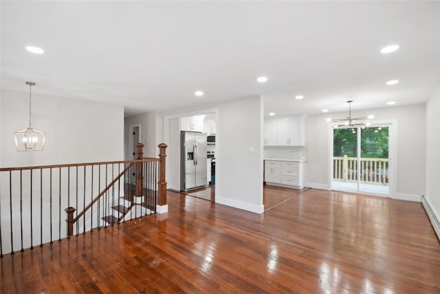 4 S Cardinal Ct, Islip, NY 11706 - unfurnished living room with a chandelier, wood finished floors, and recessed lighting