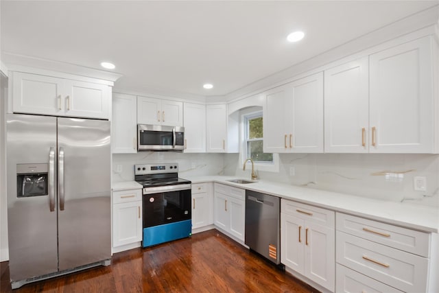 4 S Cardinal Ct, Islip, NY 11706 - kitchen with stainless steel appliances, white cabinets, dark wood-type flooring, light countertops, and recessed lighting