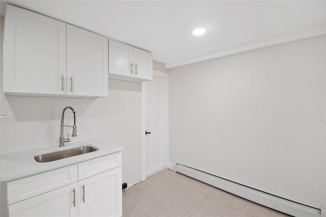 4 S Cardinal Ct, Islip, NY 11706 - kitchen with baseboard heating, white cabinetry, light countertops, and recessed lighting