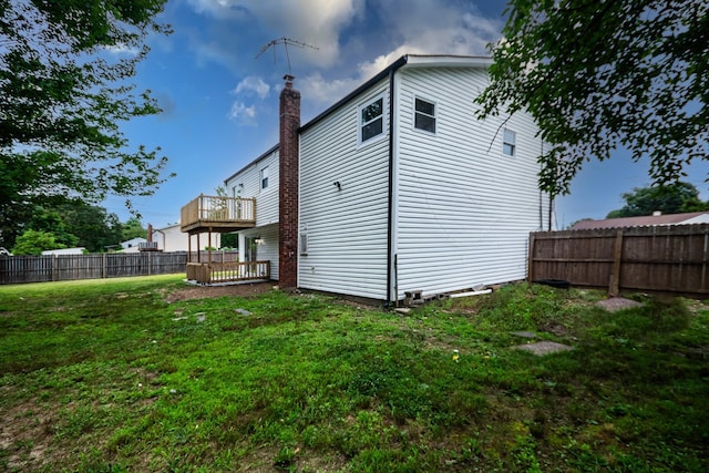 4 S Cardinal Ct, Islip, NY 11706 - rear view of house with a fenced backyard and a balcony