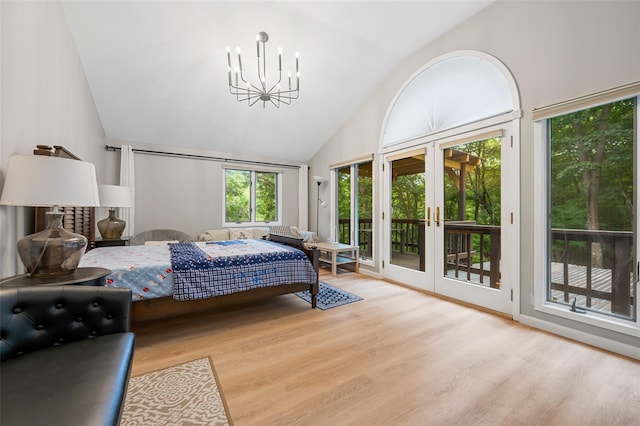 485 Harbor Rd, Cold Spring Harbor, NY 11724 - bedroom featuring access to outside, wood finished floors, a chandelier, high vaulted ceiling, and french doors