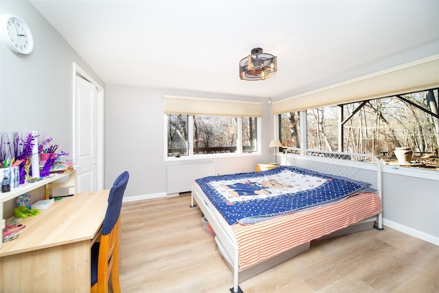 485 Harbor Rd, Cold Spring Harbor, NY 11724 - bedroom with radiator heating unit and light wood finished floors