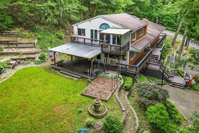 485 Harbor Rd, Cold Spring Harbor, NY 11724 - rear view of property featuring a garden, a wooden deck, a lawn, stairway, and roof with shingles