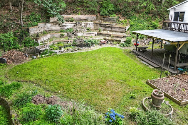 485 Harbor Rd, Cold Spring Harbor, NY 11724 - view of green lawn with a garden and a wooden deck