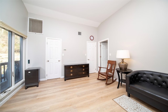 485 Harbor Rd, Cold Spring Harbor, NY 11724 - sitting room with high vaulted ceiling and light wood-type flooring