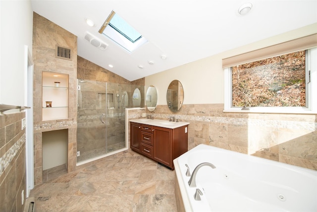 485 Harbor Rd, Cold Spring Harbor, NY 11724 - bathroom with tile walls, a skylight, lofted ceiling, vanity, and a shower stall