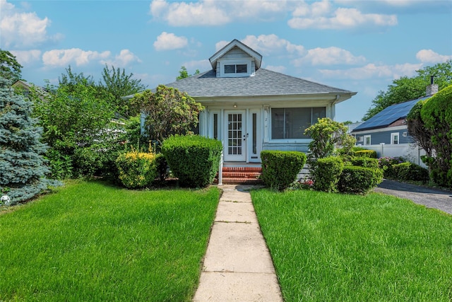 2 Florence St, North Baldwin, NY 11510 - bungalow-style home featuring a front yard and roof with shingles