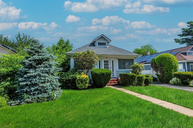 2 Florence St, North Baldwin, NY 11510 - bungalow-style home featuring a front yard and roof with shingles
