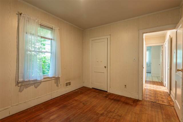 2 Florence St, North Baldwin, NY 11510 - unfurnished room with hardwood / wood-style flooring and crown molding