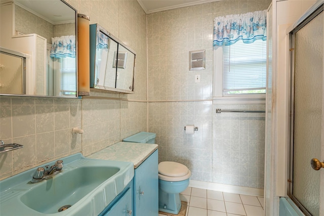2 Florence St, North Baldwin, NY 11510 - full bath featuring a shower with door, ornamental molding, tile patterned floors, vanity, and tile walls