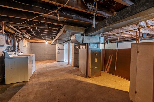 2 Florence St, North Baldwin, NY 11510 - unfinished below grade area featuring freestanding refrigerator and independent washer and dryer