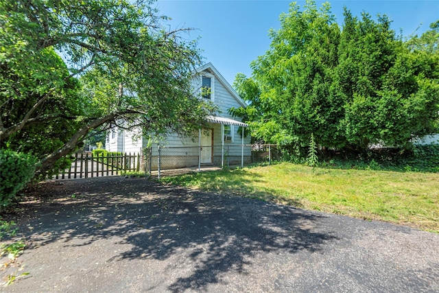 2 Florence St, North Baldwin, NY 11510 - view of side of property with a gate, asphalt driveway, and a fenced front yard