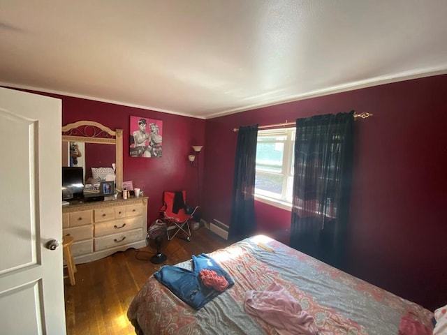 34 Columbus Ave Unit B20, Spring Valley, NY 10977 - bedroom with wood finished floors, crown molding, and a baseboard heating unit